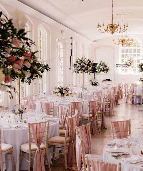 Goldney Hall wedding venue with pink chairbacks and decor.