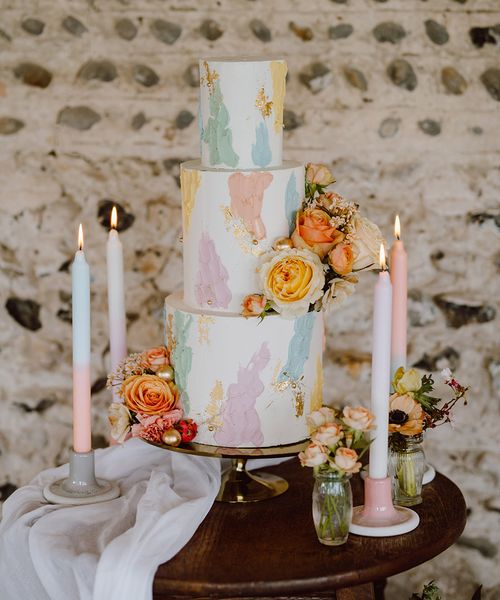 Pastel painted iced wedding cake.