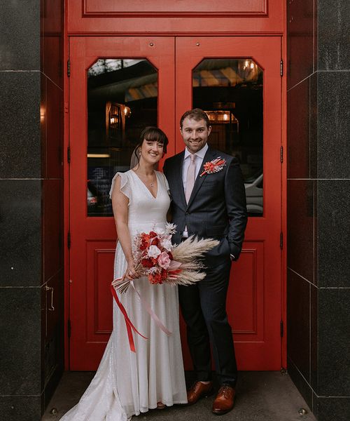 The Bedford in London wedding with bride in a sparkly wedding dress and groom in navy suit.