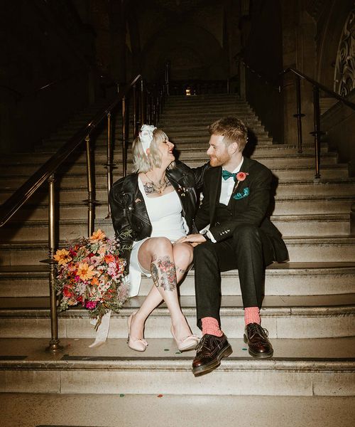 Oxford town hall wedding with bride in short wedding dress and leather jacket