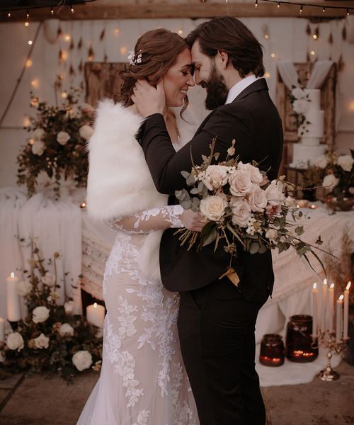 Bride and groom for their black tie rustic winter wedding.