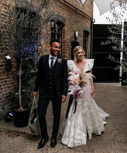 Contemporary London Wedding at The Loft Studios with Ruffle Wedding Dress by Epic Love Story 