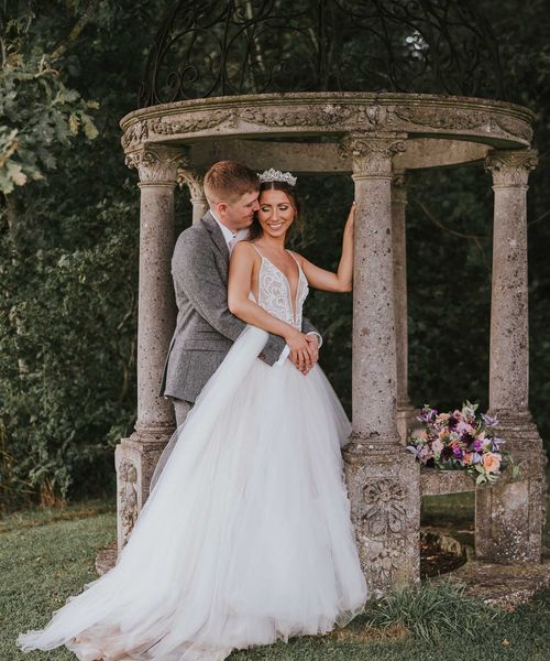 Rustic summer wedding complete with a fun hydration station and a pink and grey colour scheme.