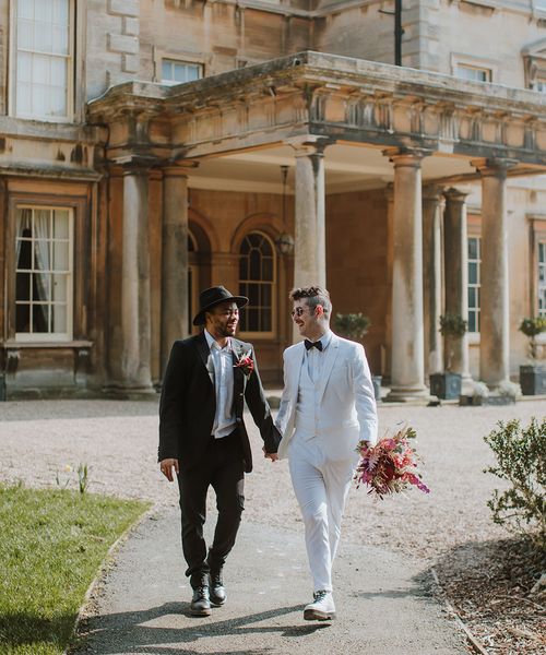 red, pink, black and white groom suit ideas for LGBTQI+ inspiration at Prestwold Hall Barns