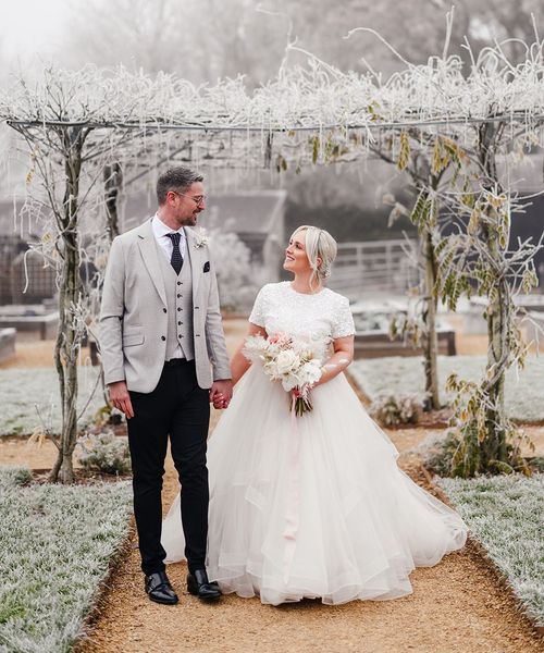 Tulle bridal skirt and beaded top separates worn by bride for winter wedding.