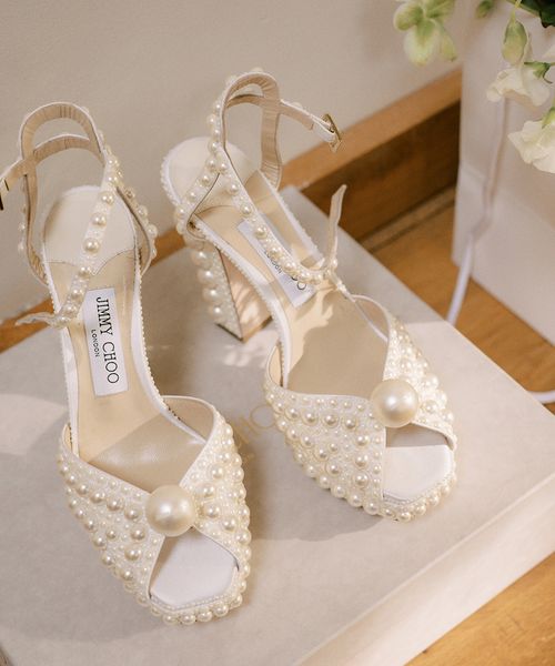 Jimmy Choo pearl shoes with platform heel.