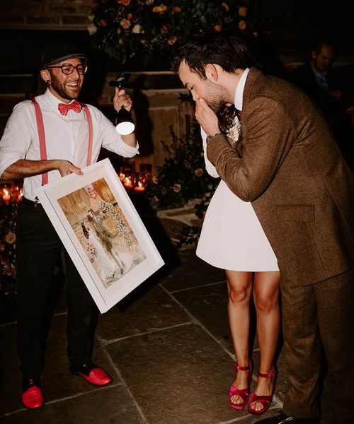 a live wedding illustrator produces a painting wedding keepsake