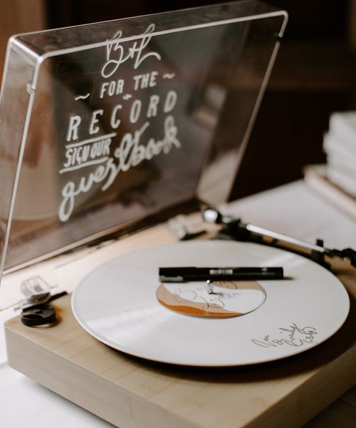 Record player alternative wedding guest book idea.