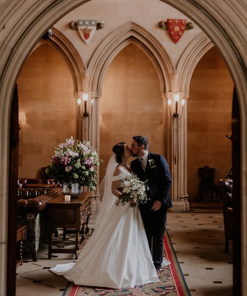 Bride and groom kiss for their classic wedding at Maften Hall.