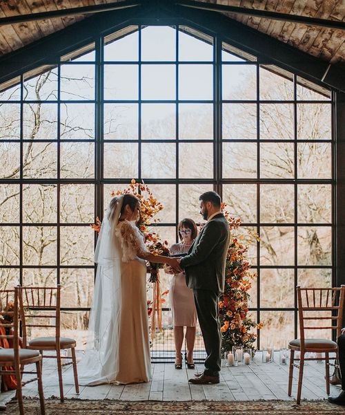 Hidden River Barn wedding in Carlisle with stunning large windows