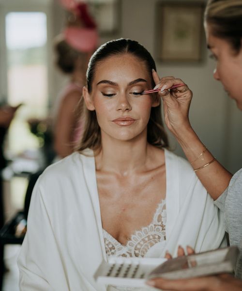 bride-gets-makeup-done-for-wedding-day-pre-wedding-beauty