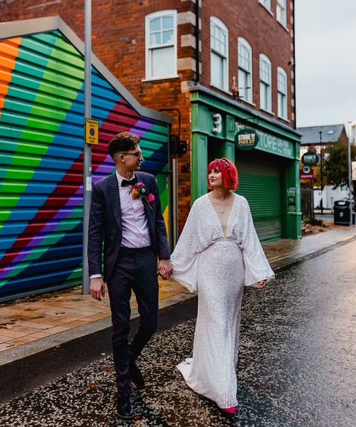 bride-wearing-asos-sequin-bat-wing-wedding-dress-with-groom-in-purple-checkered-suit-Dandrew-Photography