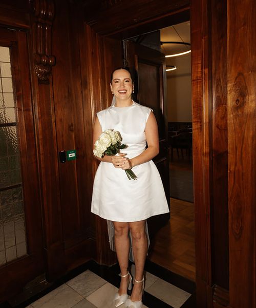 Bride wearing budget-friendly Odd Muse short wedding dress for city town hall wedding