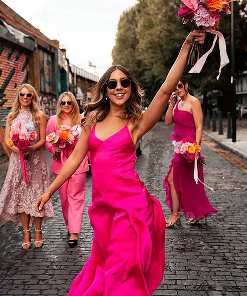 bridesmaids wearing hot pink mismatched bridesmaid dresses