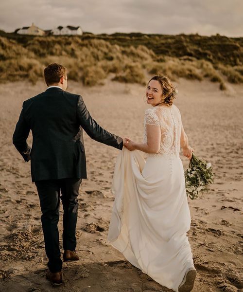 Bride in lace overlay wedding dress for coastal Irish wedding