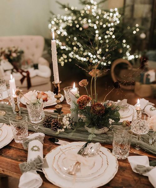 festive Christmas table decorations with green wedding decorations, including christmas crackers