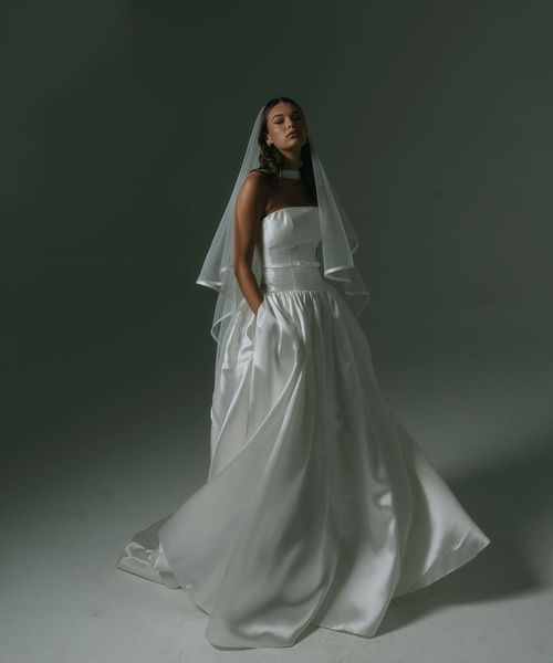 drop waist wedding dress with strapless neckline, boned bodice, thin belt and full skirt by Hera Couture