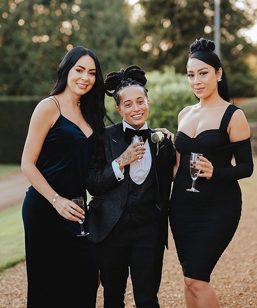 bride and two guests/ bridesmaids wearing black tie dress code for LGBTQIA+ wedding 