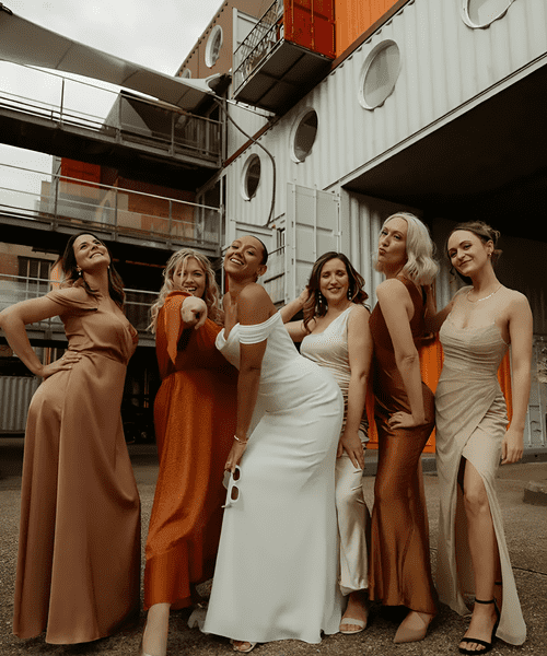 mismatched orange and neutral bridesmaid dresses for wedding colour palette 