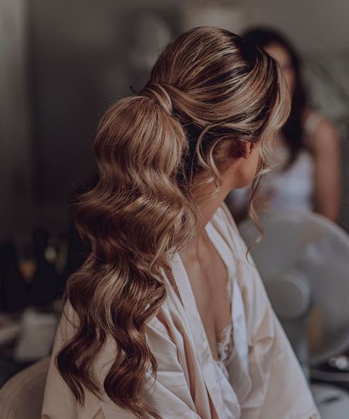 Bride with delicate wedding hair updo