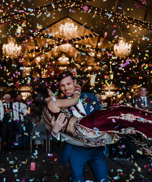 Anglo Indian Fusion Wedding for 200 guests at Wharfedale Grange, Yorkshire. Bride wears a traditional Lengha. Photography by Kazooieloki.