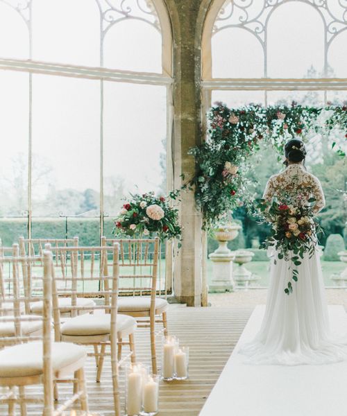 Blush & Burgundy Floral Fairytale Wedding at Grittleton House Planned & Styled by Jennifer Louise Weddings with Floral Arch. Katherine Yiannaki Photography