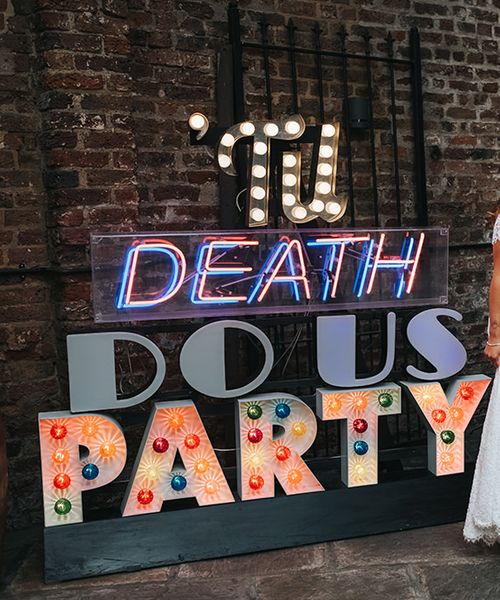 High Street Wedding Dress for an Intimate Crouch End Pub Wedding with Bright Flowers and 'Til Death Do Us Party Neon Sign, shot by Miss Gen Photography