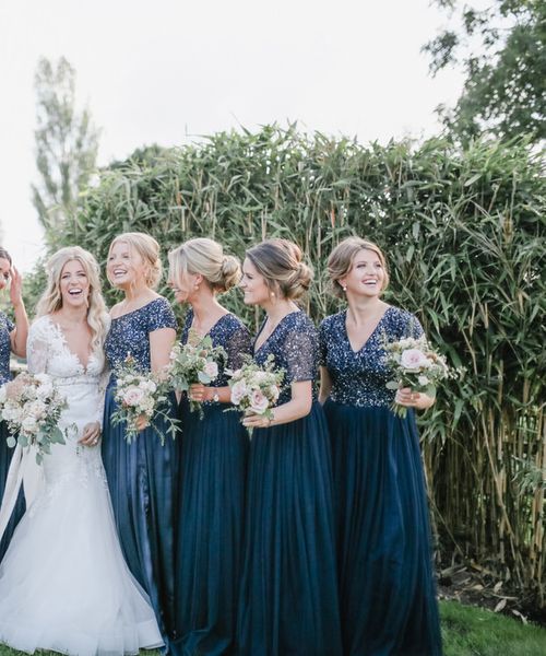 Navy Bridesmaid Dresses and Lace Wedding Dress for a Home Marquee Wedding