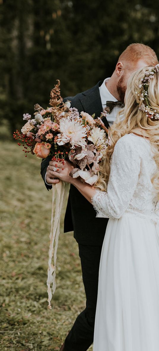 Dolomites Wedding on a mountain top with autumnal wedding bouquet and flower crown