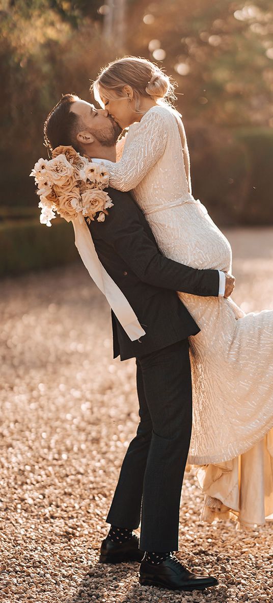 Bride and groom share a passionate and romantic kiss
