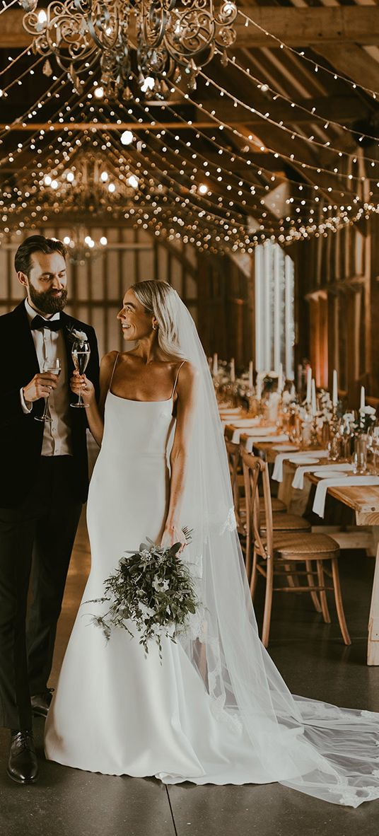 rustic barn wedding couple portrait for wedding insurance article