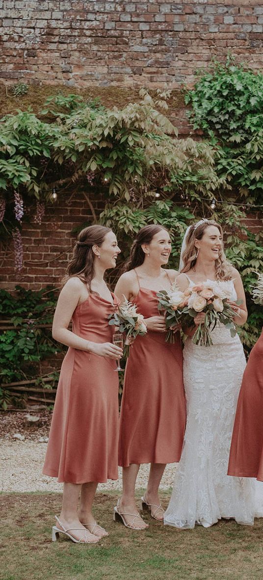 Bridal party wearing midi bridesmaid dresses