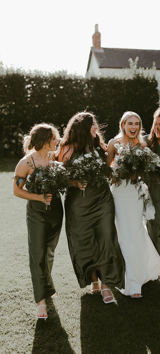 Dark green bridesmaid dresses for the bridal party at a traditional minimal wedding.