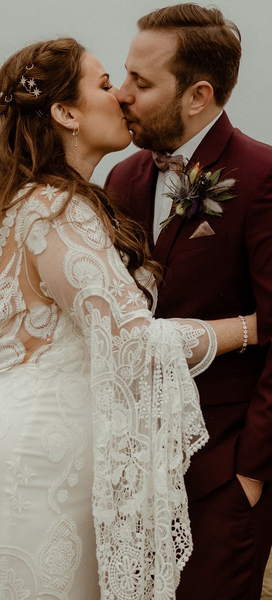 Boho Newton Hall wedding with the bride in a lace wedding dress.