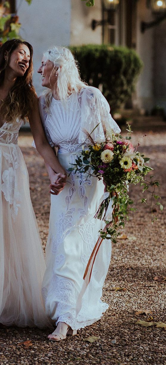 Aswarby Rectory wedding with two brides in boho lace wedding dresses