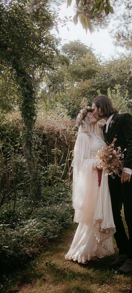 outdoor pagan wedding with vintage wedding dress and dried wedding flowers