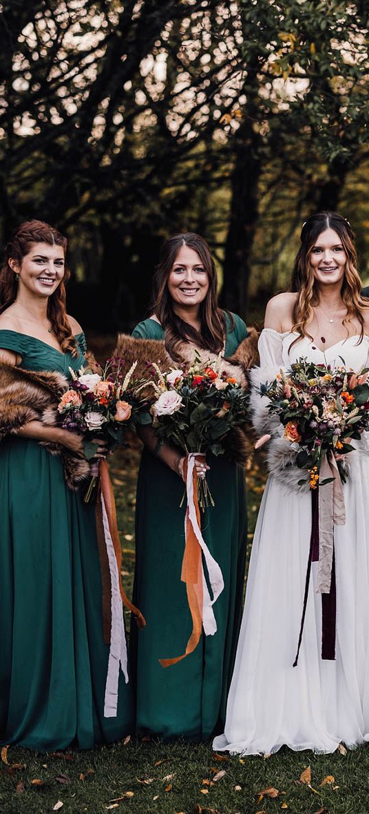 Forest green autumnal bridesmaid dresses for November wedding at Cripps Barn.