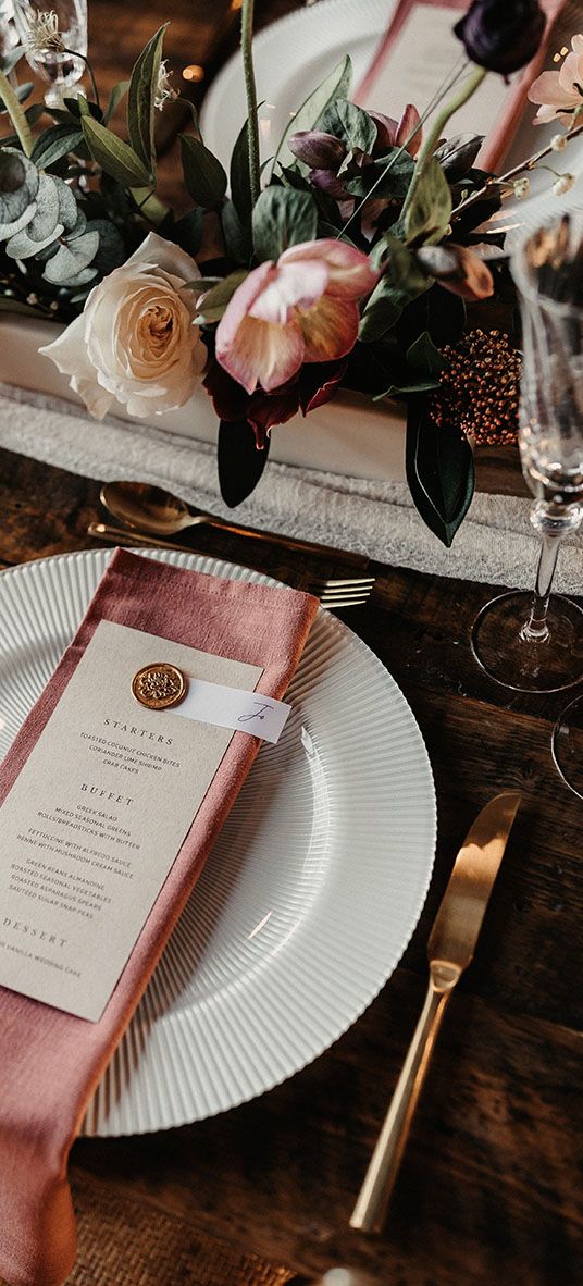 wedding menu card on pink napkin for place setting
