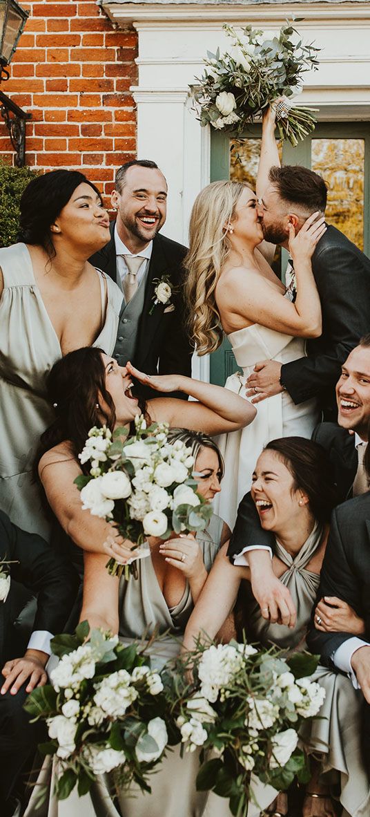 Villiers Barn wedding with the wedding party wearing green themed outfits