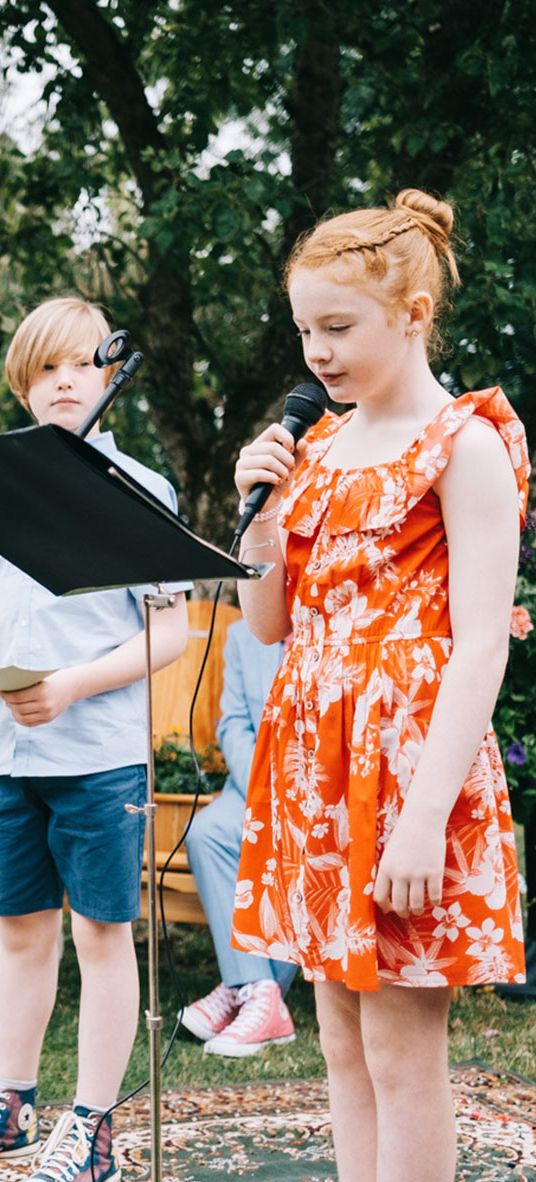 Child performing a reading at a wedding from children's wedding readings.