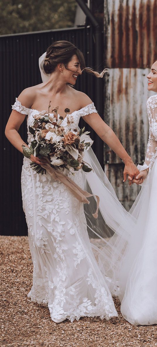 Stone Barn wedding with the brides in flower wedding dresses