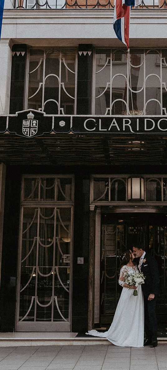 Claridge's wedding in London with black tie dress code and bride in maternity wedding dress.