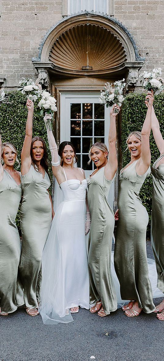 bridal party in green satin bridesmaid dresses