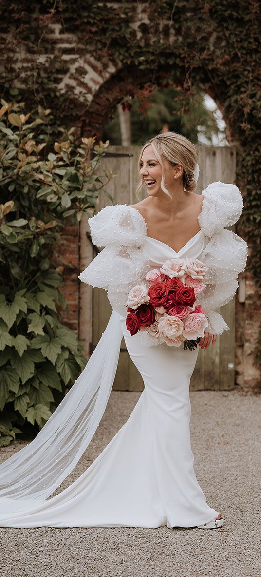 Red and pink wedding theme with the bride wearing a Chosen by Kyha wedding dress.