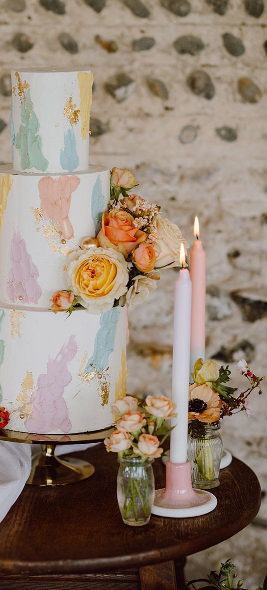 Pastel painted iced wedding cake.