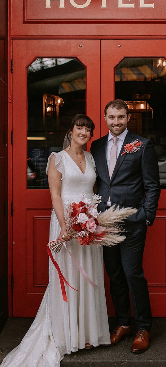 The Bedford in London wedding with bride in a sparkly wedding dress and groom in navy suit.