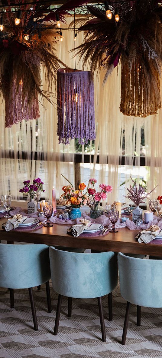 Brazil destination wedding at villa mandacaru with purple theme tablescape and statement hanging lights