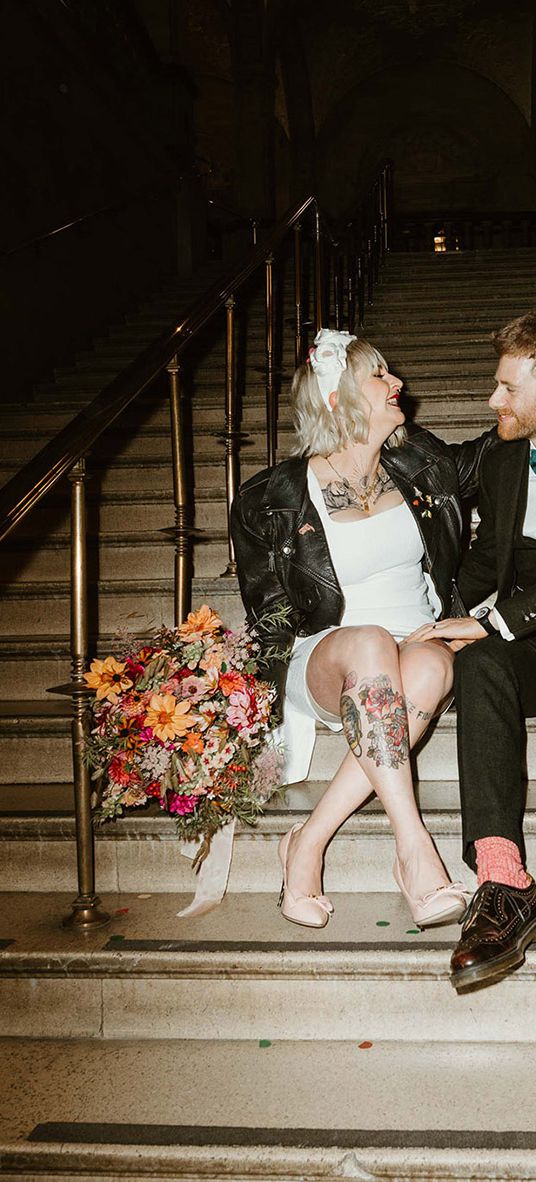 Oxford town hall wedding with bride in short wedding dress and leather jacket