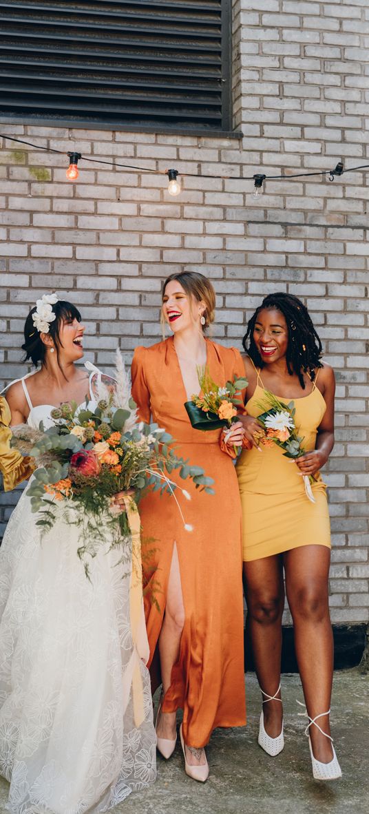 Mustard and orange wedding inspiration at an industrial wedding venue 