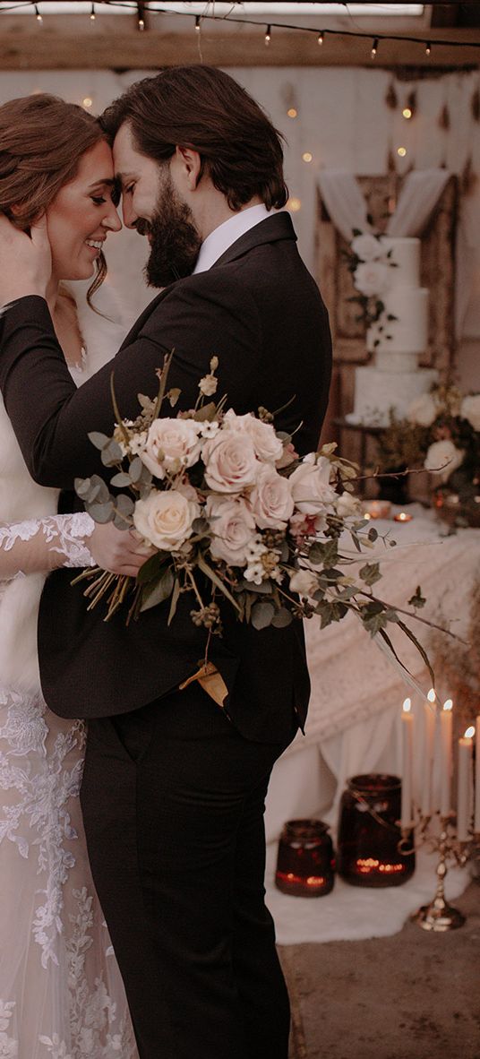 Bride and groom for their black tie rustic winter wedding.